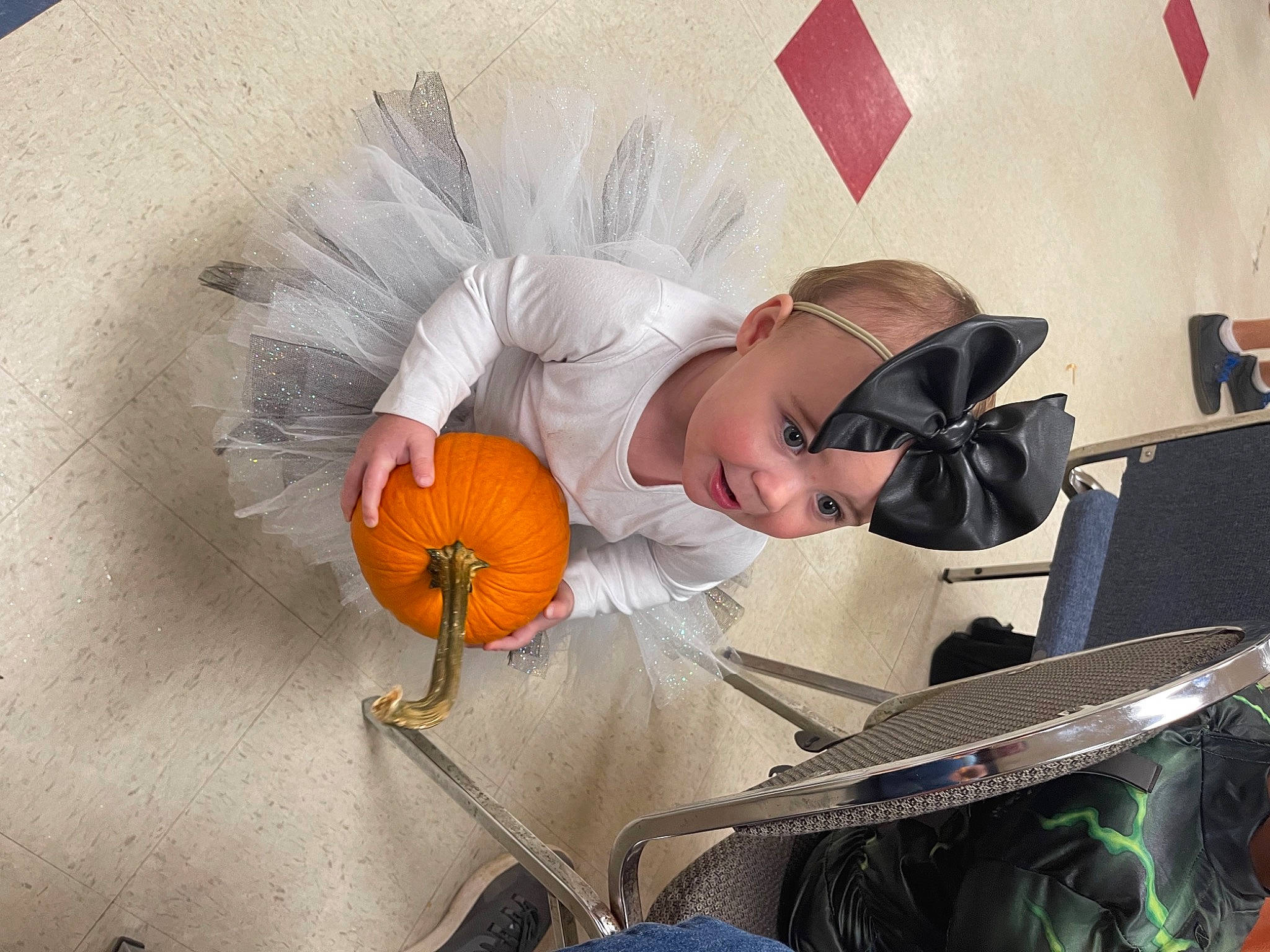 Aaliyah joined the competition — help win amazing prizes! art, baby_products, chair, child, comfort, eyewear, fashion_accessory, flower, hat, headgear, headwear, illustration, office_equipment, paper, person, personal_protective_equipment, petal, reading, room, sitting