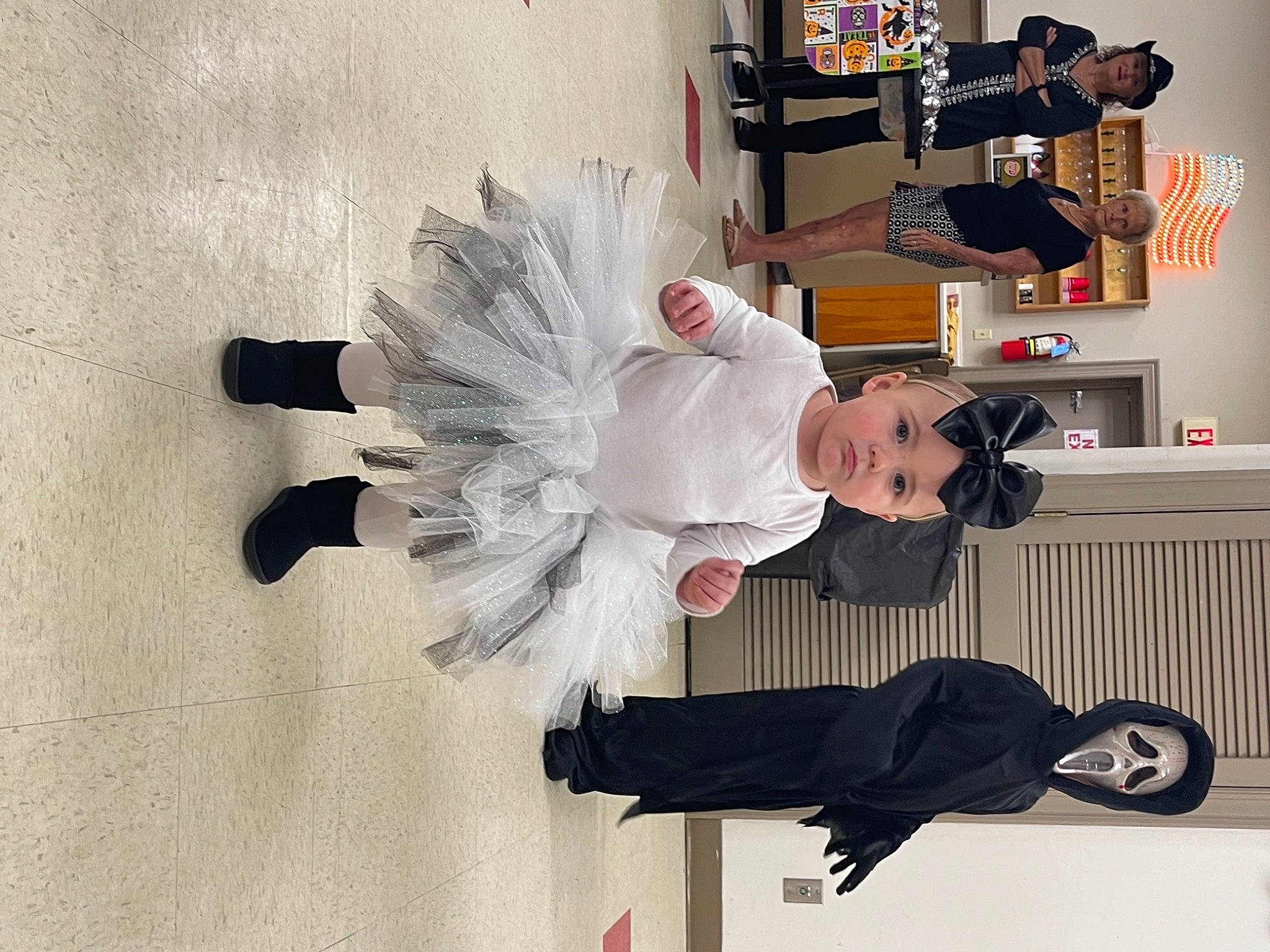 Aaliyah joined the competition — help win amazing prizes! costume, costume_design, event, fashion_design, feather, flooring, formal_wear, fur, gesture, headwear, joy, person, room, suit, tail, wing