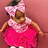 baby, bow, child, clothing, couch, curious, cute, fashion, furniture, happy, headband, indoor, infant, person, pink, portrait, sitting, sock, tutu, young
