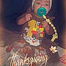 baby, child, thanksgiving, pacifier, headband, bow, turkey, clothing, sitting, bed, blanket, cute, festive, holiday, infant, smiling, indoors, portrait, warm_filter, text_overlay