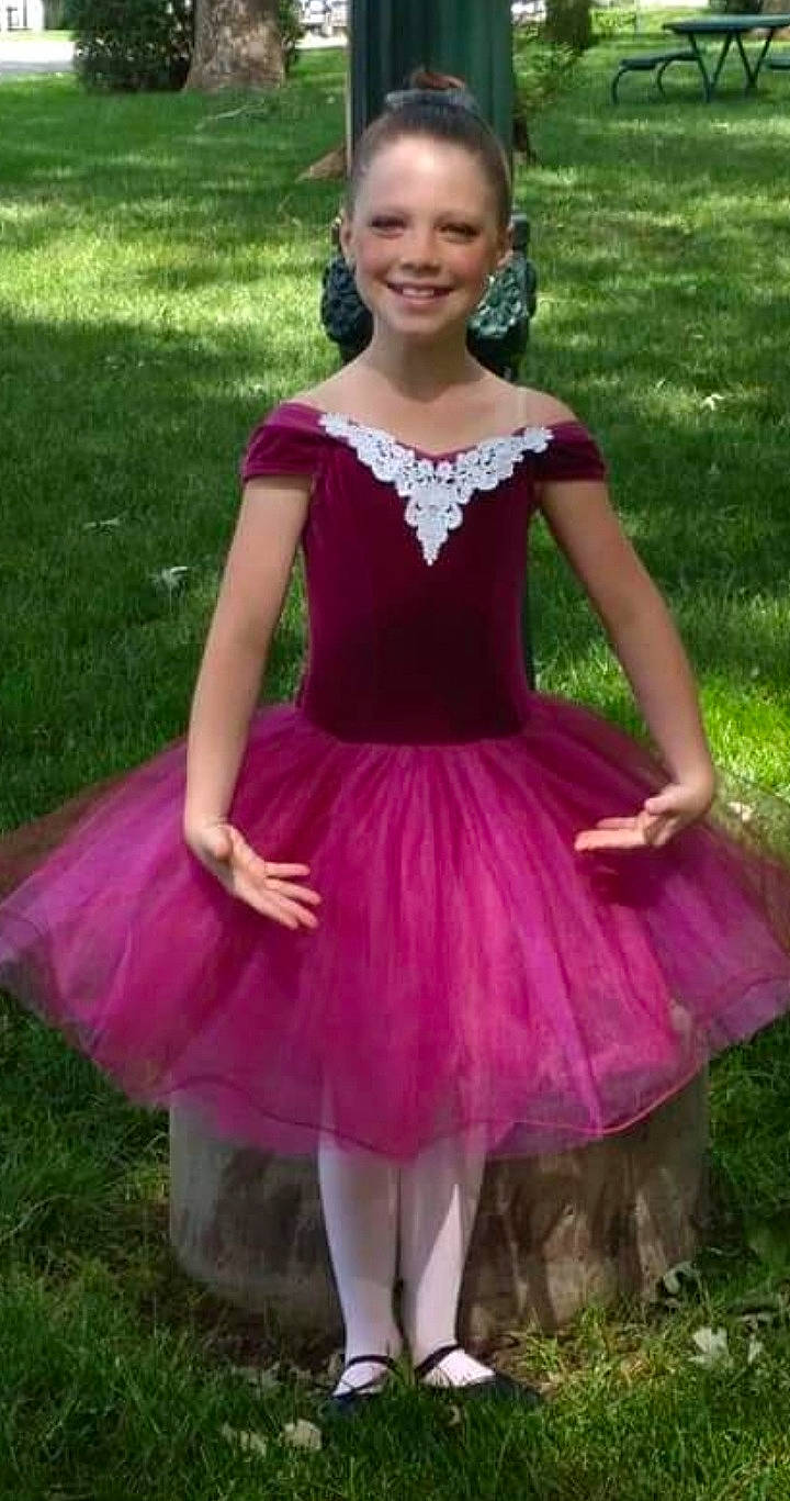 Karleigh is registered to the contest to win money with this photo: arm, baby_toddler_clothing, ballet_tutu, beauty, child, day_dress, dress, embellishment, grass, happy, human_body, joy, magenta, outerwear, person, pink, purple, ruffle, sleeve, smile