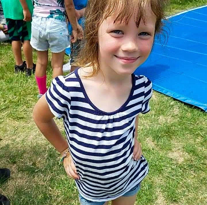 Karleigh is registered to the contest to win money with this photo: blue, child, cool, electric_blue, fun, grass, green, happy, joy, leisure, people, people_in_nature, person, recreation, shorts, sleeve, smile, summer, t_shirt, thigh