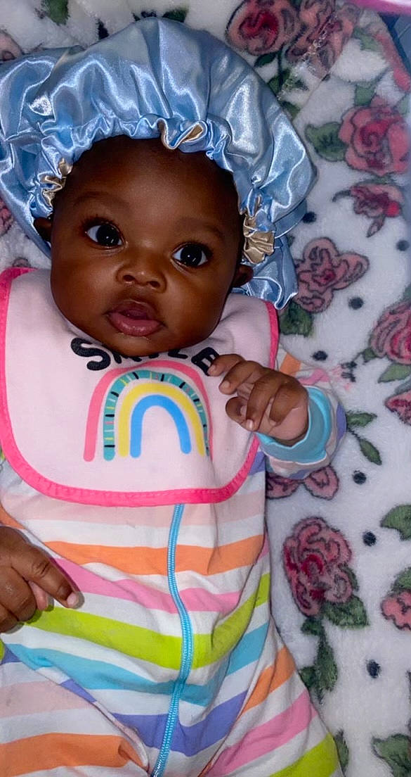 Harmoni is registered to the contest to win money with this photo: baby, baby_products, baby_toddler_clothing, cheek, child, eye, face, fashion_accessory, happy, head, iris, linens, lip, nose, person, pink, skin, sleeve, t_shirt, textile