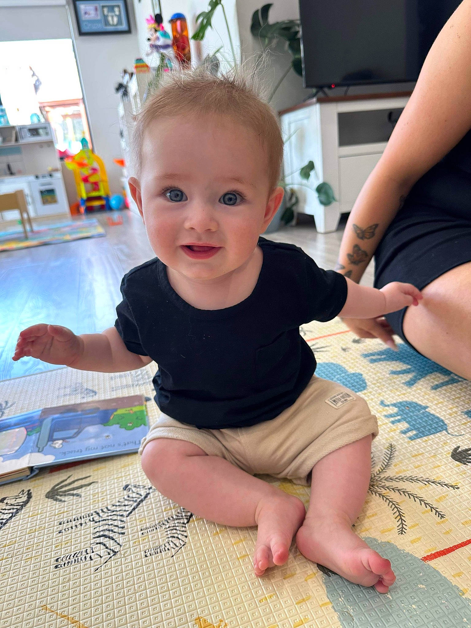 Kyan is registered to the contest to win money with this photo: baby, baby_toddler_clothing, cheek, child, eye, finger, floor, flooring, foot, fun, happy, head, joint, joy, people, person, picture_frame, skin, sleeve, smile