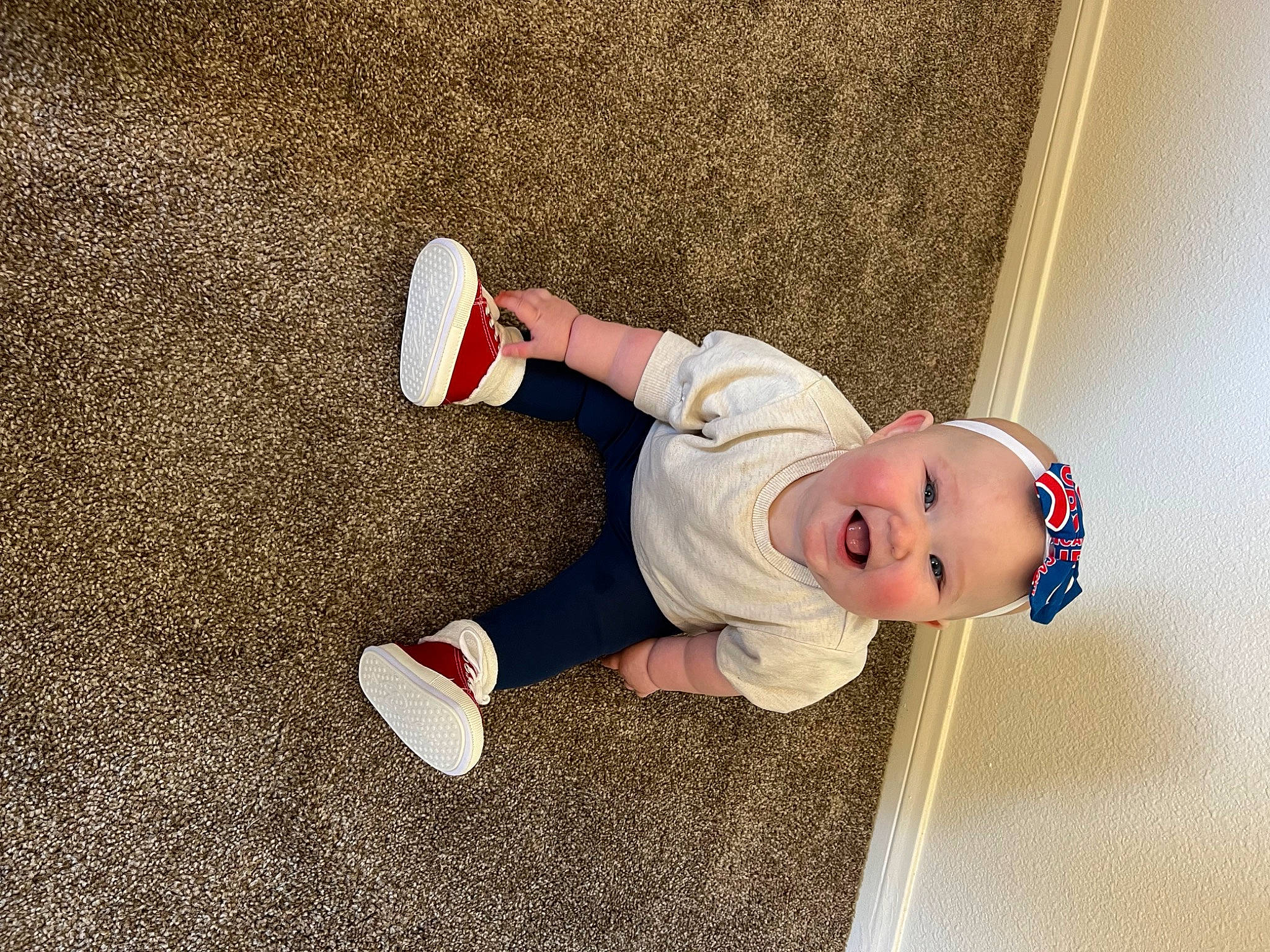 Emry joined the competition — help win amazing prizes! baby, baby_toddler_clothing, carmine, child, flooring, foot, fun, happy, hat, human_leg, knee, leg, people_in_nature, person, shadow, sitting, smile, sock, soil, toddler