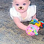 baby, infant, crawling, toy, carpet, indoor, child, face_filter, dog_filter, leopard_ears, cute, playful, white_clothing, colorful_toys, hand, expression, young_child, person, floor, fun