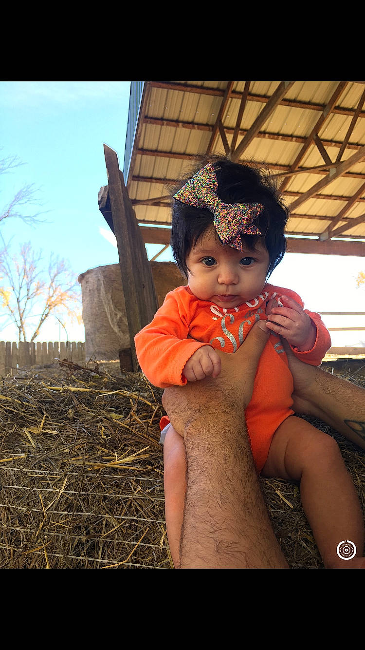 Gwendolyn is registered to the contest to win money with this photo: black_hair, child, fun, girl, hand, headgear, human, leg, person, toddler, vacation