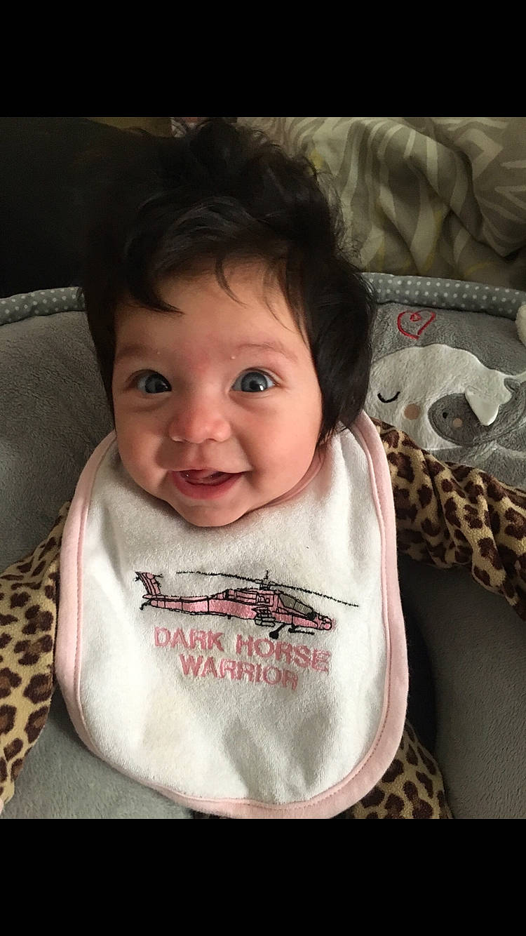 Gwendolyn is registered to the contest to win money with this photo: cheek, child, chin, eye, face, forehead, girl, head, human, infant, lip, mouth, neck, nose, person, product, skin, smile, toddler