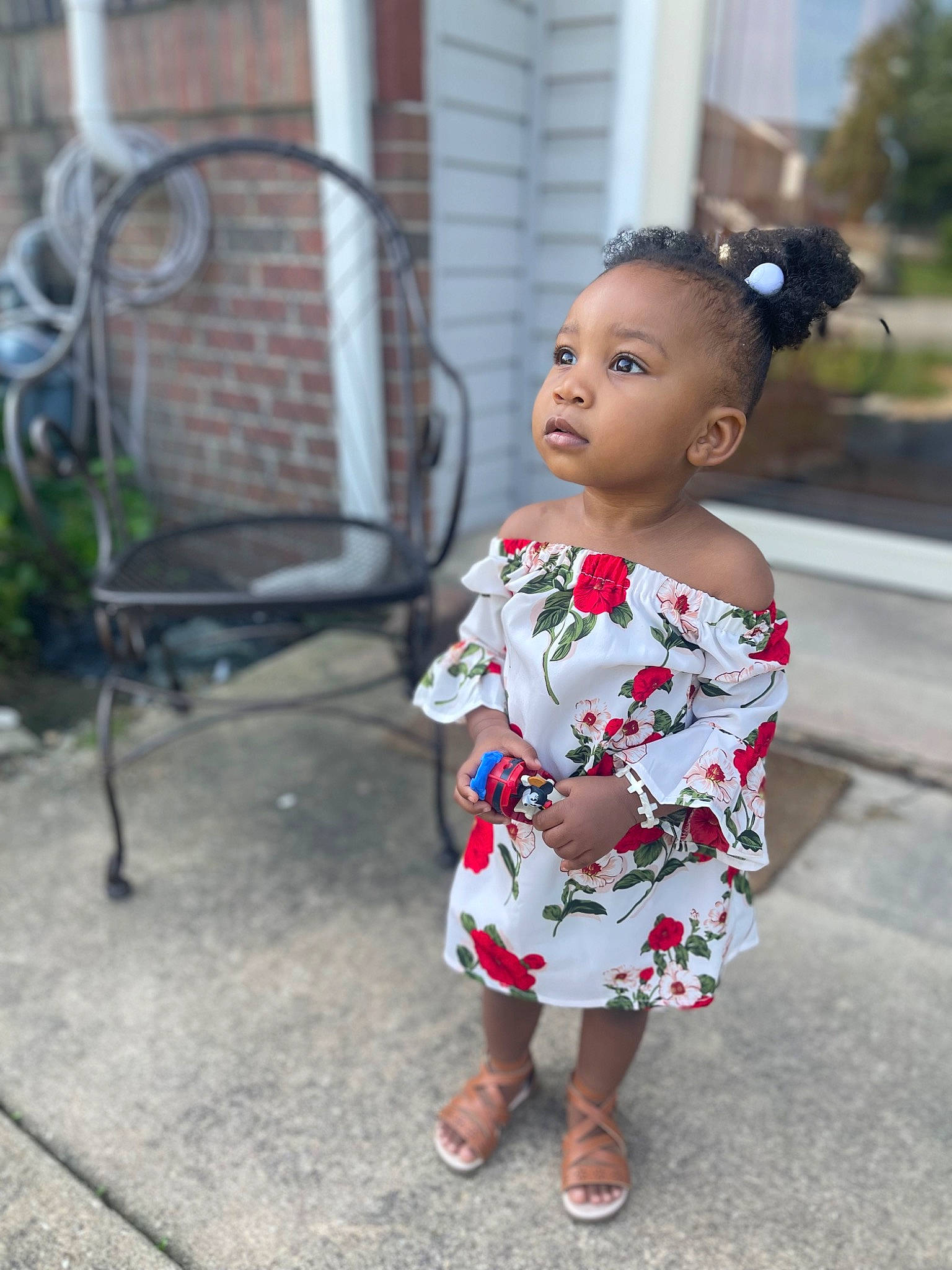 Niara joined the competition — help win amazing prizes! baby_toddler_clothing, chair, child, day_dress, dress, fashion_design, flip_flops, grass, hairstyle, human_leg, jewellery, one_piece_garment, pattern, person, sandal, sitting, street, street_fashion, toddler, toy