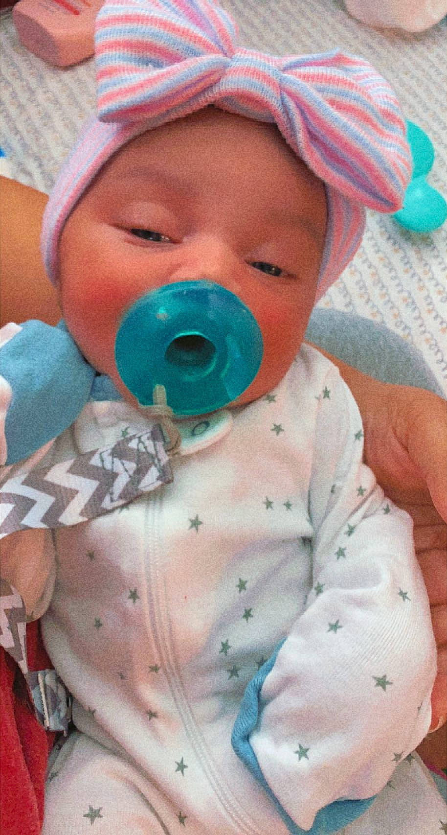 Keeley joined the competition — help win amazing prizes! baby, baby_toddler_clothing, blue, cap, cheek, child, chin, cool, eyelash, face, finger, happy, hat, head, headwear, mouth, nose, person, pink, skin