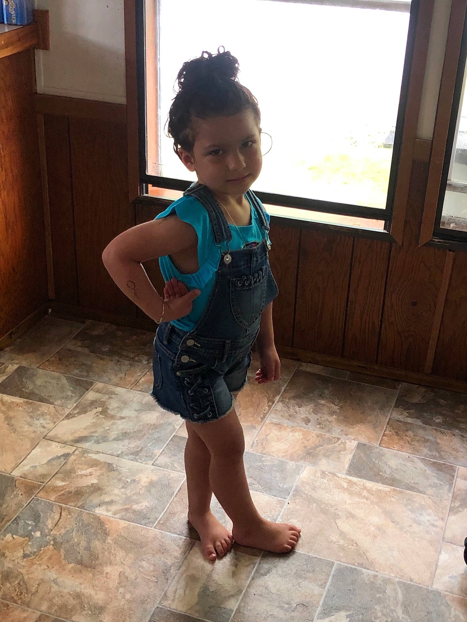 Hope is registered to the contest to win money with this photo: child, floor, flooring, human_leg, joint, leg, person, shoulder, standing, tile, toddler, vacation