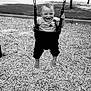 Ryker is registered to the contest to win money with this photo: child, toddler, baby, swing, bucket_swing, playground, park, woodchips, barefoot, smiling, happy, child_playing, chains, playground_equipment, trees, grass, black_and_white, portrait, outdoor, clothing
