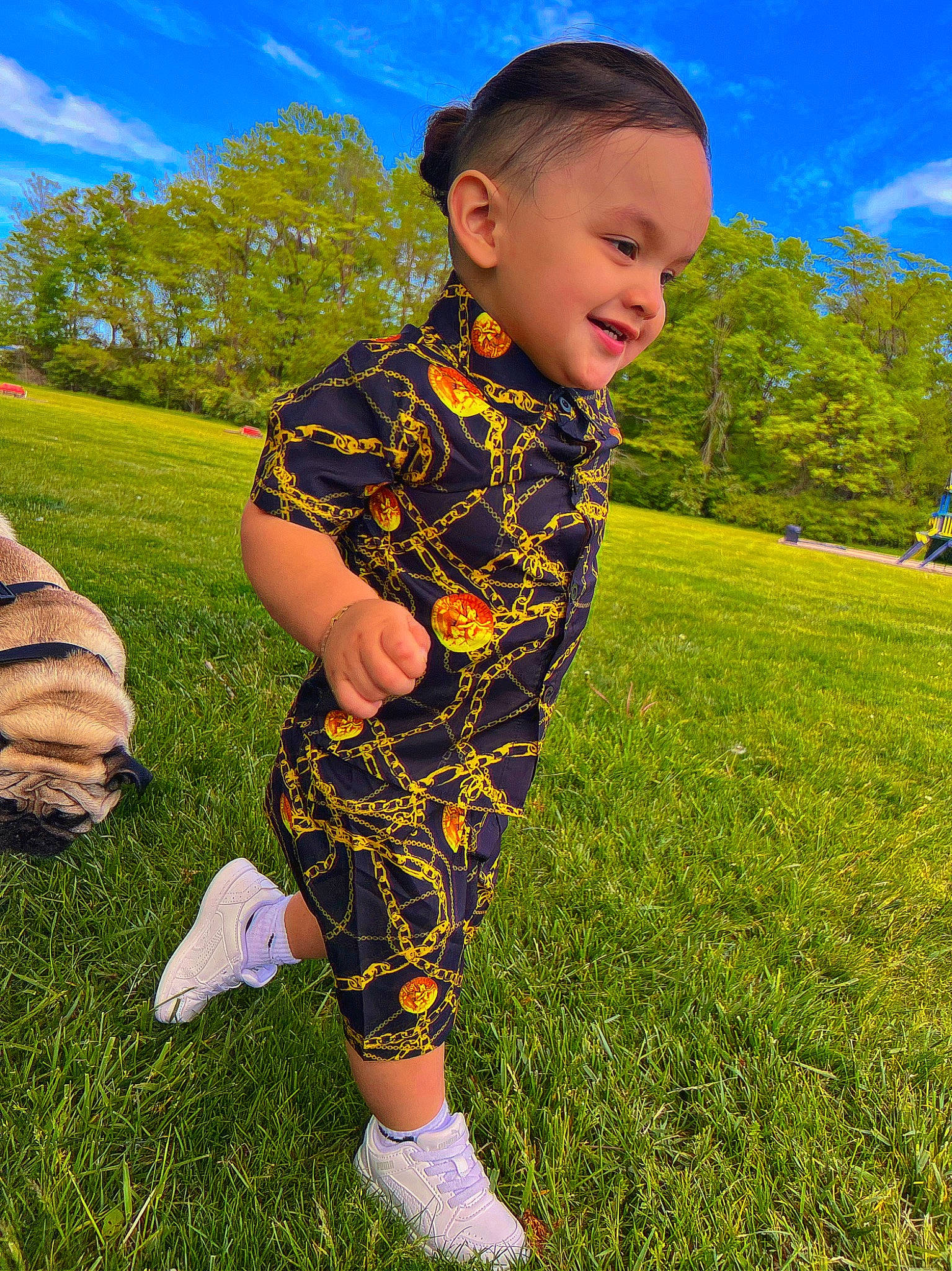 Jesus is registered to the contest to win money with this photo: baby_toddler_clothing, child, cloud, electric_blue, fun, grass, grass_family, grassland, happy, joy, lawn, leisure, meadow, people_in_nature, person, plant, recreation, sky, sleeve, smile