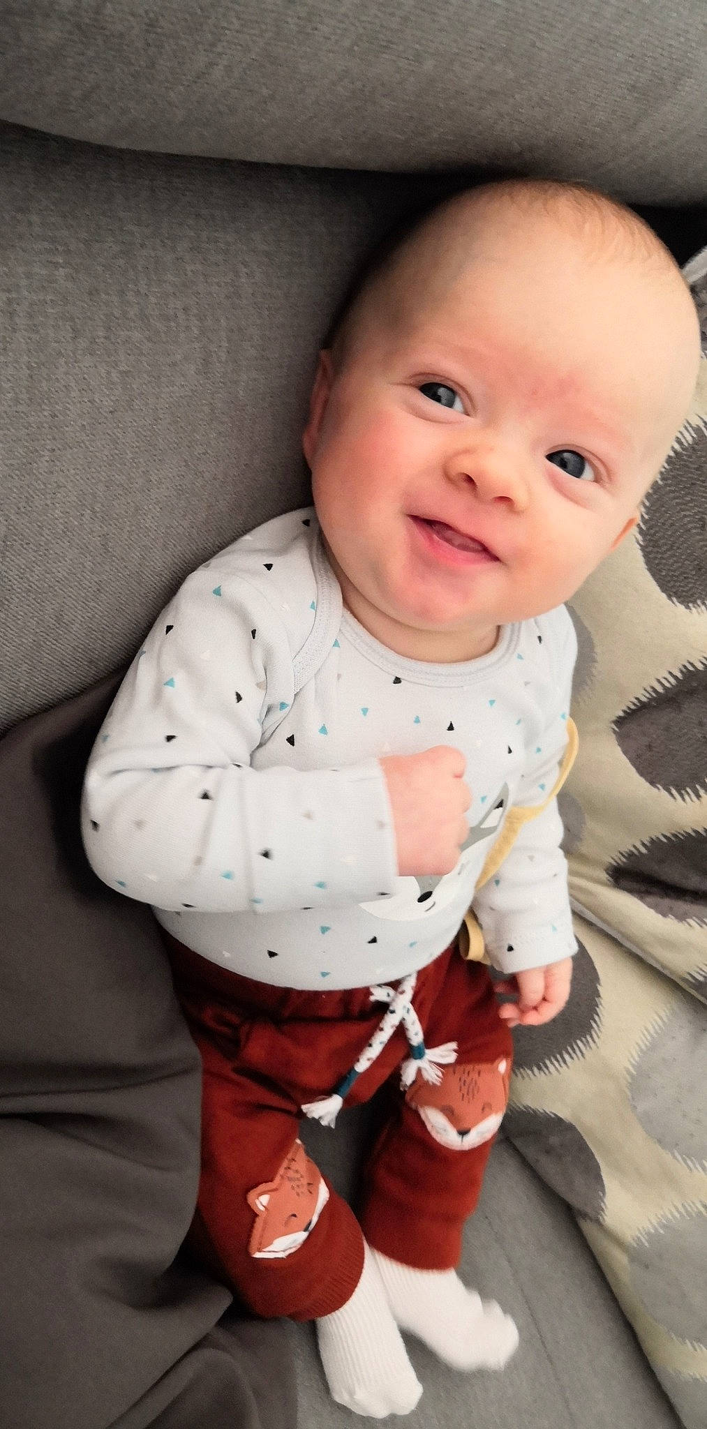 Kyle participe au concours pour gagner de l'argent avec cette photo : baby, baby_products, baby_toddler_clothing, cheek, child, lip, nose, pattern, person, product, sitting, skin, sleeve, smile, toddler