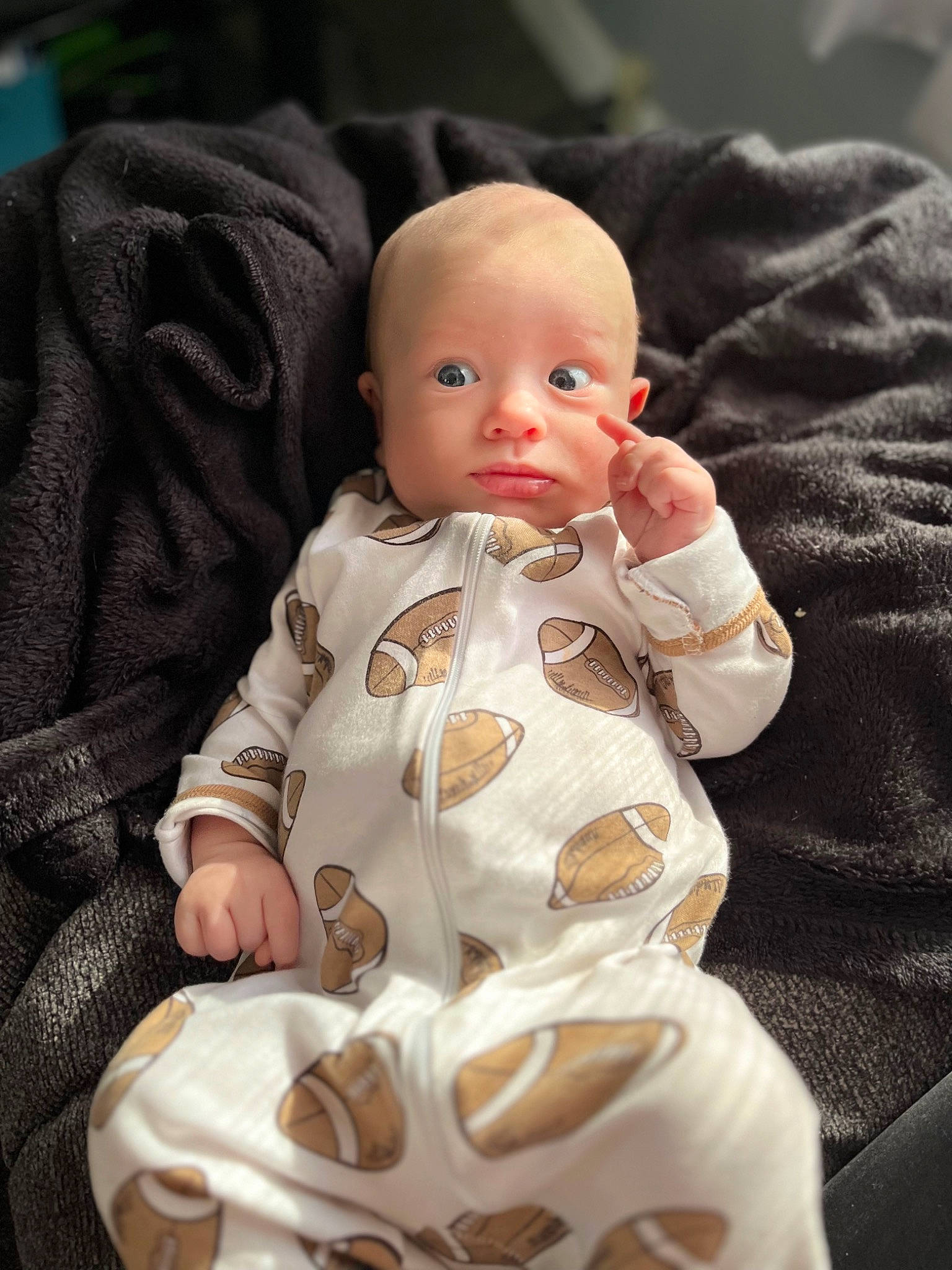 Garrett is registered to the contest to win money with this photo: baby, baby_toddler_clothing, carmine, cheek, child, collar, comfort, doll, formal_wear, fur, head, linens, peach, person, sitting, skin, sleeve, textile, thumb, toddler