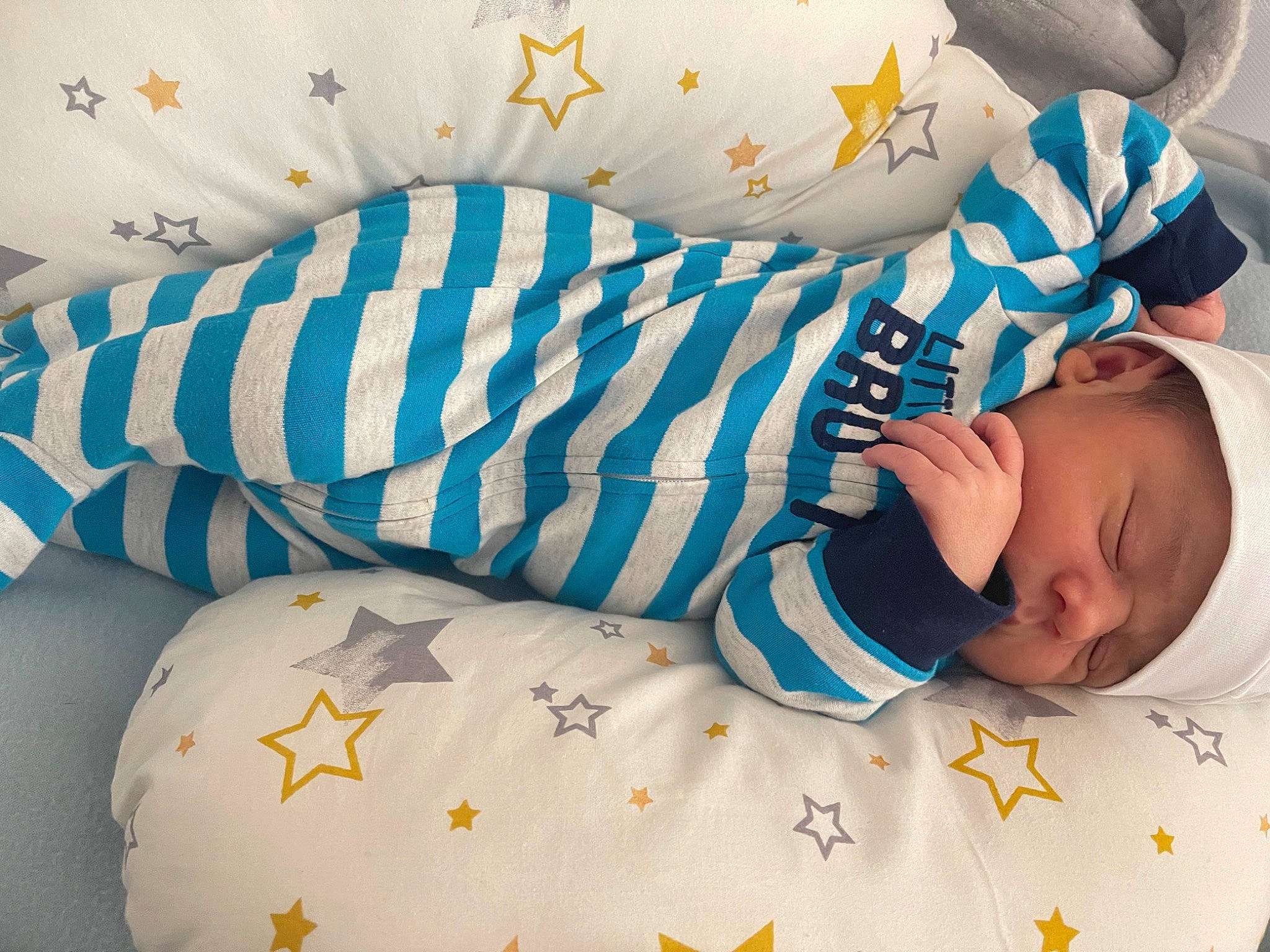 Lucas is registered to the contest to win money with this photo: arm, azure, baby, baby_products, baby_sleeping, baby_toddler_clothing, bed, bedding, bedtime, child, comfort, couch, linens, pattern, person, product, skin, sleeve, textile, toddler