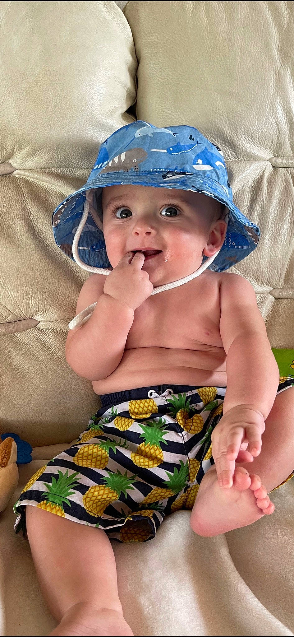 Kasen is registered to the contest to win money with this photo: baby, baby_products, baby_toddler_clothing, blue, cap, child, comfort, electric_blue, fashion_accessory, fun, happy, hat, headwear, human_leg, pattern, person, skin, smile, sun_hat, thigh