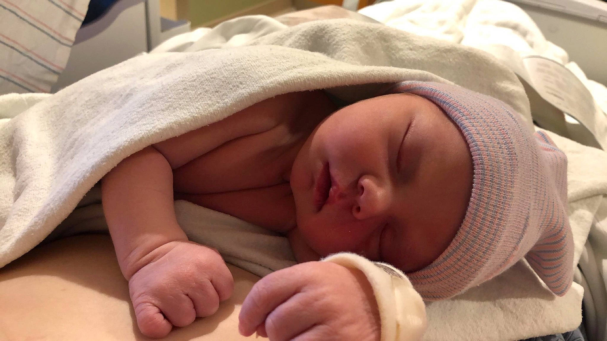 Grayson is registered to the contest to win money with this photo: baby, baby_sleeping, bedtime, birth, child, childbirth, comfort, hand, headwear, nap, person, skin, sleep, toddler