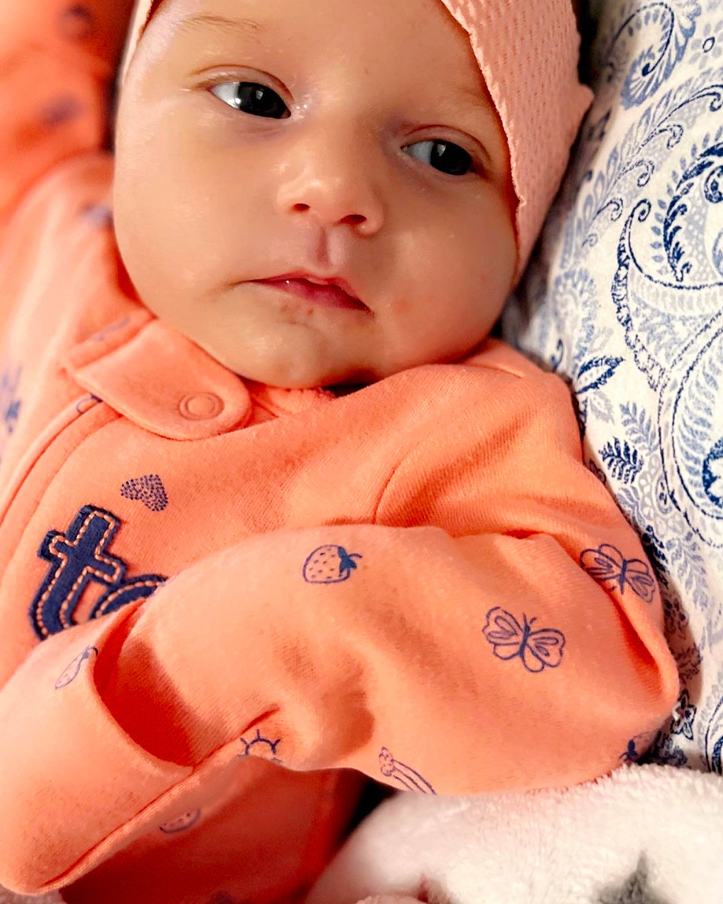 Kaitlyn is registered to the contest to win money with this photo: baby, baby_toddler_clothing, cap, cheek, chin, eyebrow, eyelash, finger, gesture, happy, headwear, human, lip, mouth, muscle, neck, nose, organ, person, pink