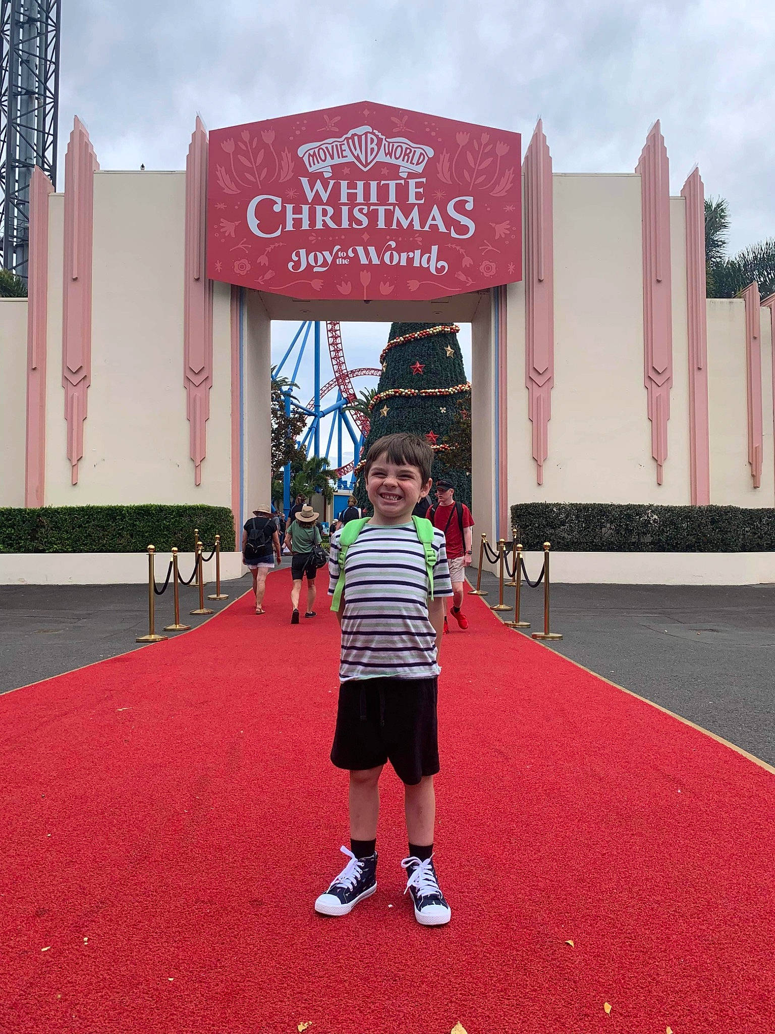 Axl joined the competition — help win amazing prizes! advertising, carpet, city, cloud, flooring, font, fun, grass, headwear, joy, leisure, magenta, person, pink, recreation, room, shorts, signage, sky, t_shirt