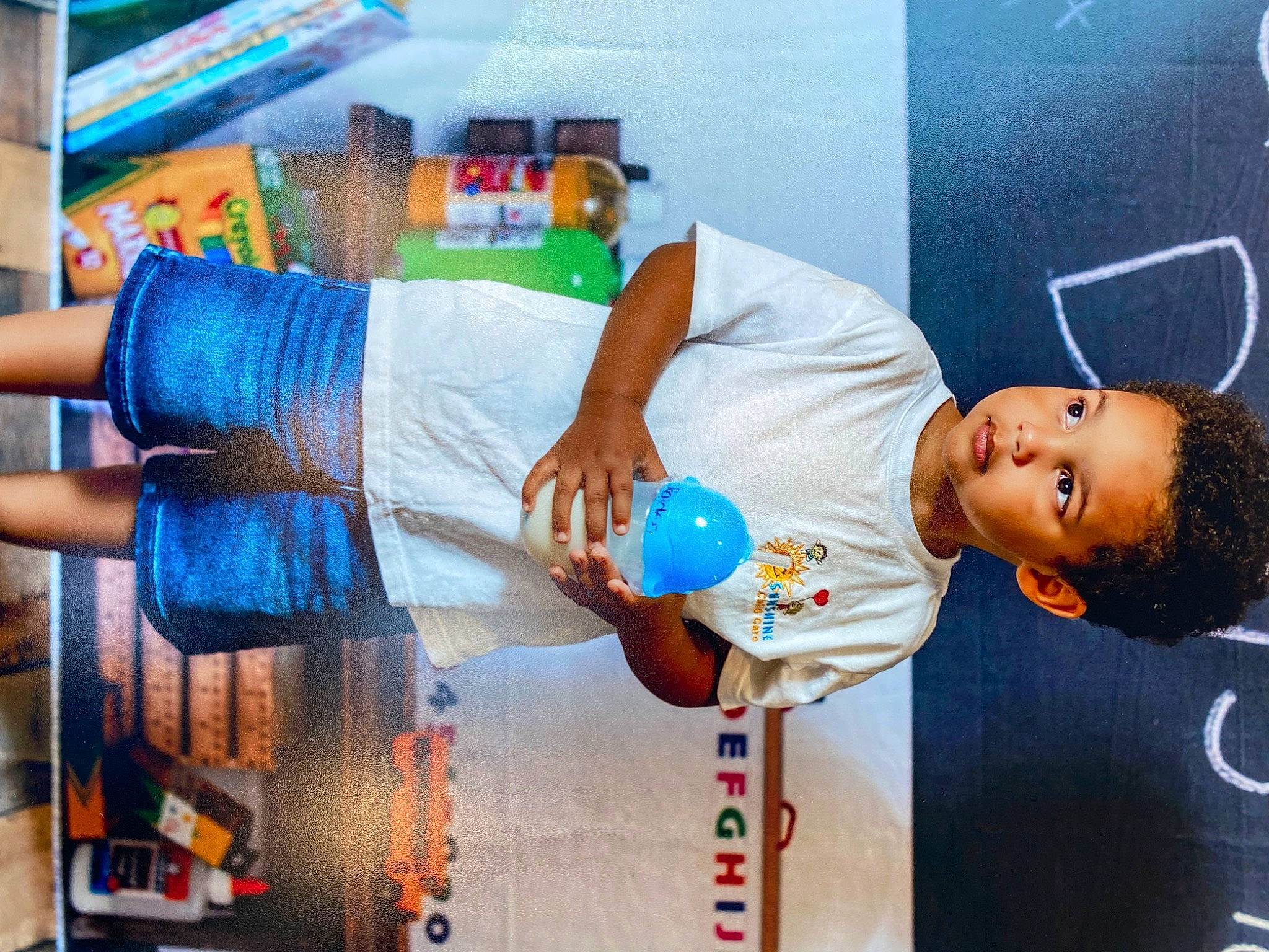 Raiden is registered to the contest to win money with this photo: baby_products, child, elbow, electric_blue, event, fun, happy, leisure, person, plastic, plastic_bottle, room, service, t_shirt, textile, water