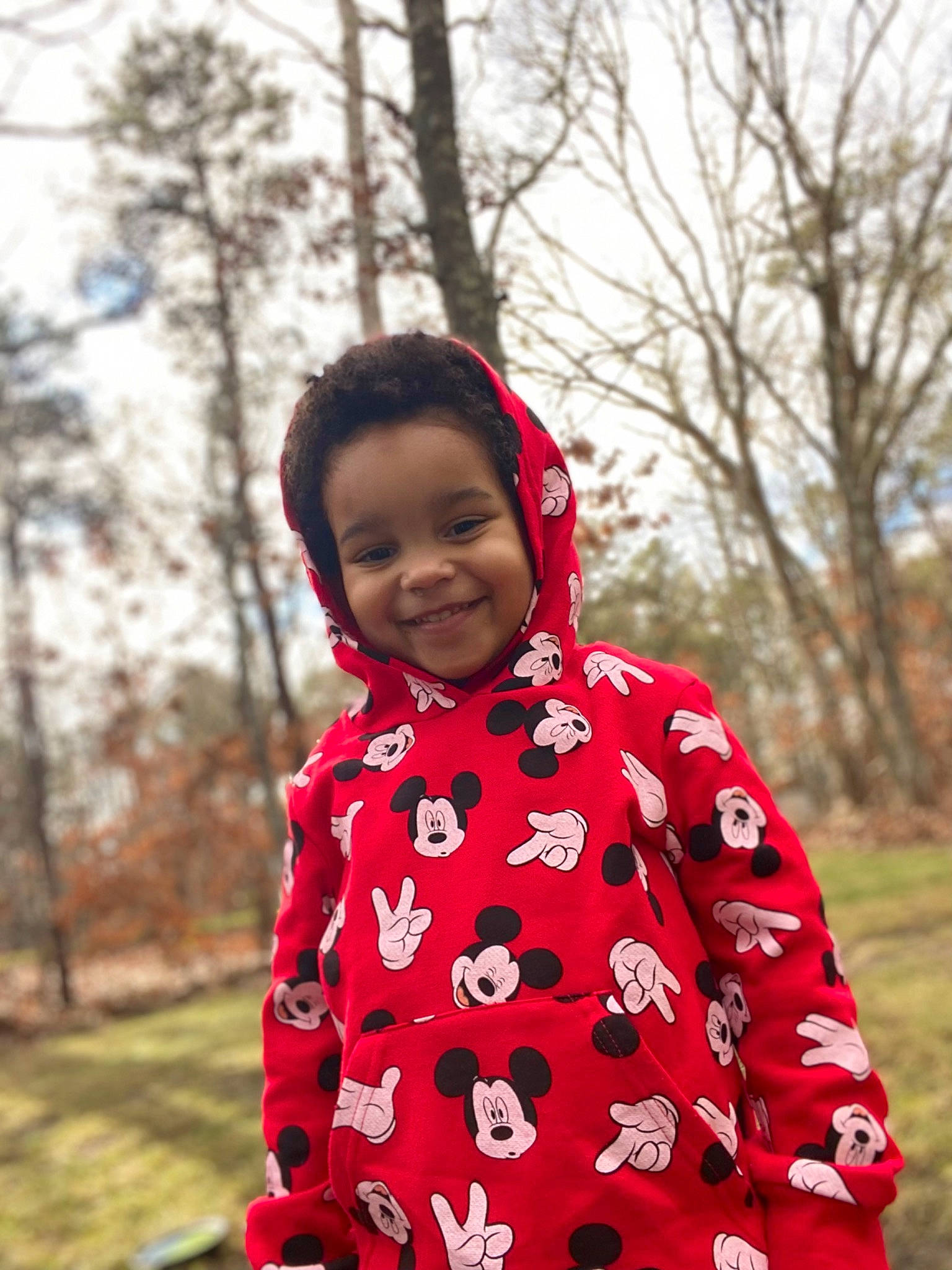 Raiden is registered to the contest to win money with this photo: baby, clothing, gesture, grass, happy, jacket, joy, leaf, leisure, magenta, outerwear, people_in_nature, person, plant, recreation, sky, sleeve, smile, standing, street_fashion