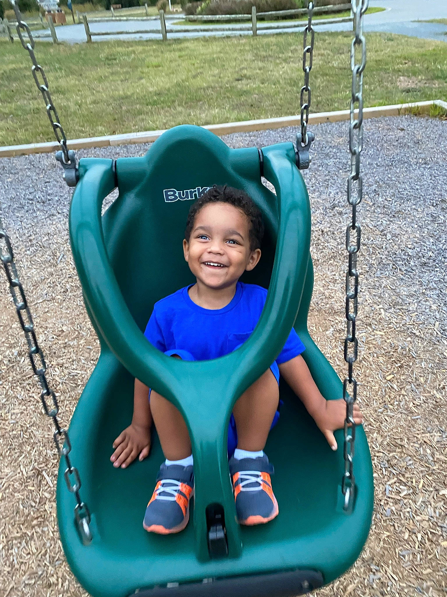 Raiden is registered to the contest to win money with this photo: baby, baby_toddler_clothing, child, city, electric_blue, eye, fun, grass, green, happy, joy, leisure, outdoor_play_equipment, person, photograph, playground, product, recreation, smile, swing
