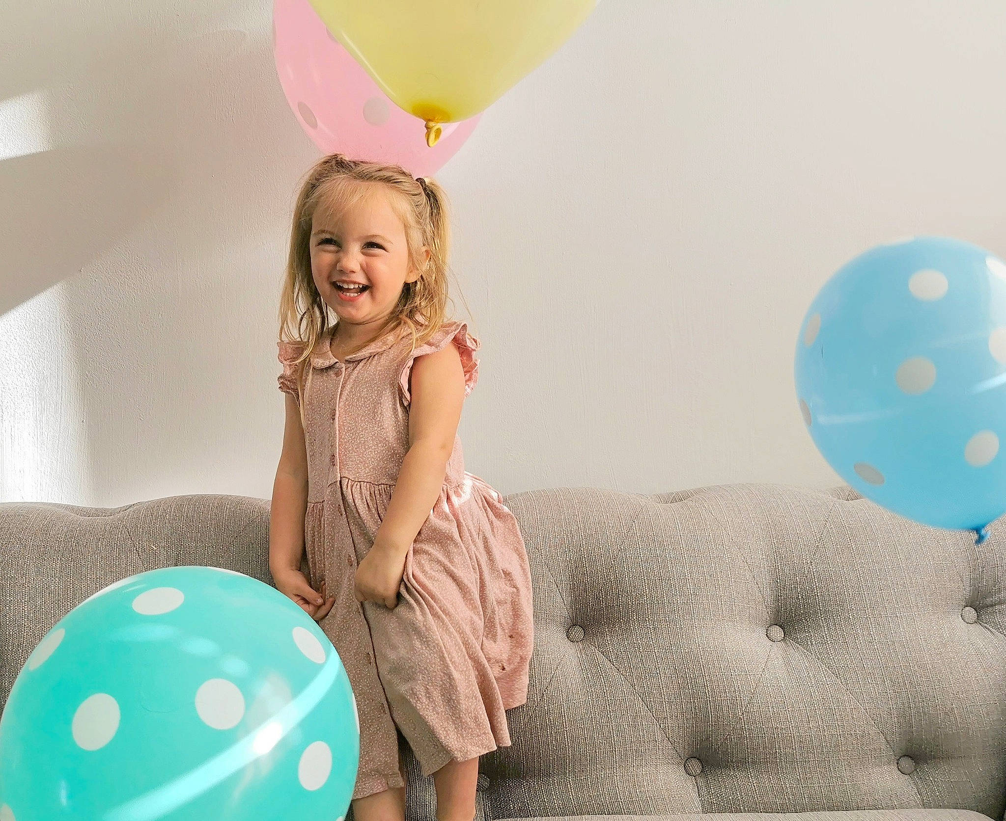 Isabella joined the competition — help win amazing prizes! balloon, child, design, furniture, happy, joy, party, party_supply, pattern, person, photography, pink, play, polka_dot, room, sitting, smile, toddler, toy, turquoise