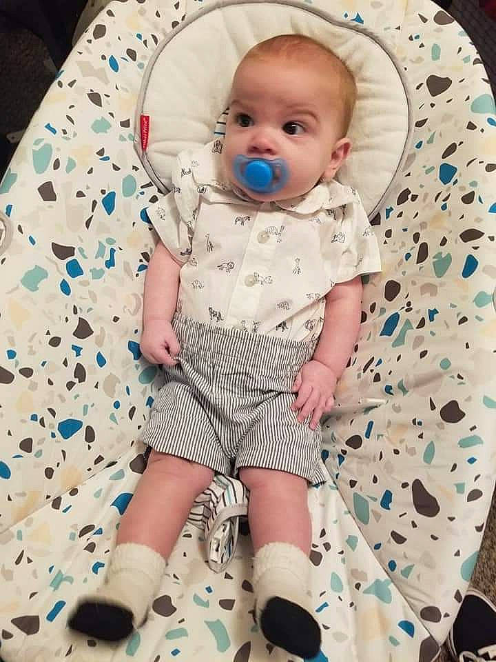 Conner is registered to the contest to win money with this photo: baby, baby_products, baby_toddler_clothing, cheek, child, collar, comfort, electric_blue, happy, linens, pattern, person, product, sitting, skin, sleeve, sock, textile, thigh, toddler