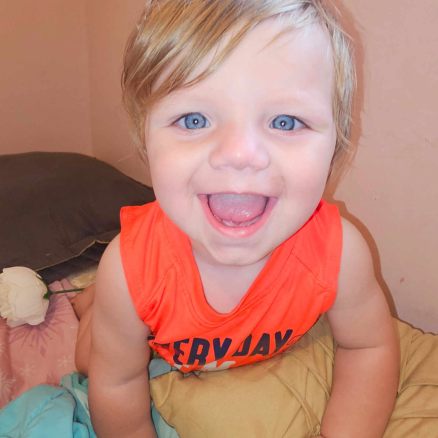 Kolby is registered to the contest to win money with this photo: baby, bed, bedroom, bodypart, clothing, couch, cushion, face, furniture, happy, head, homedecor, indoors, laughing, mouth, person, photography, portrait, t_shirt, teeth