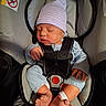 newborn, baby, car_seat, infant, sleeping, hat, clothing, straps, feet, toes, hand, blue, pink, striped, safety, seat, child, cute, indoors, resting