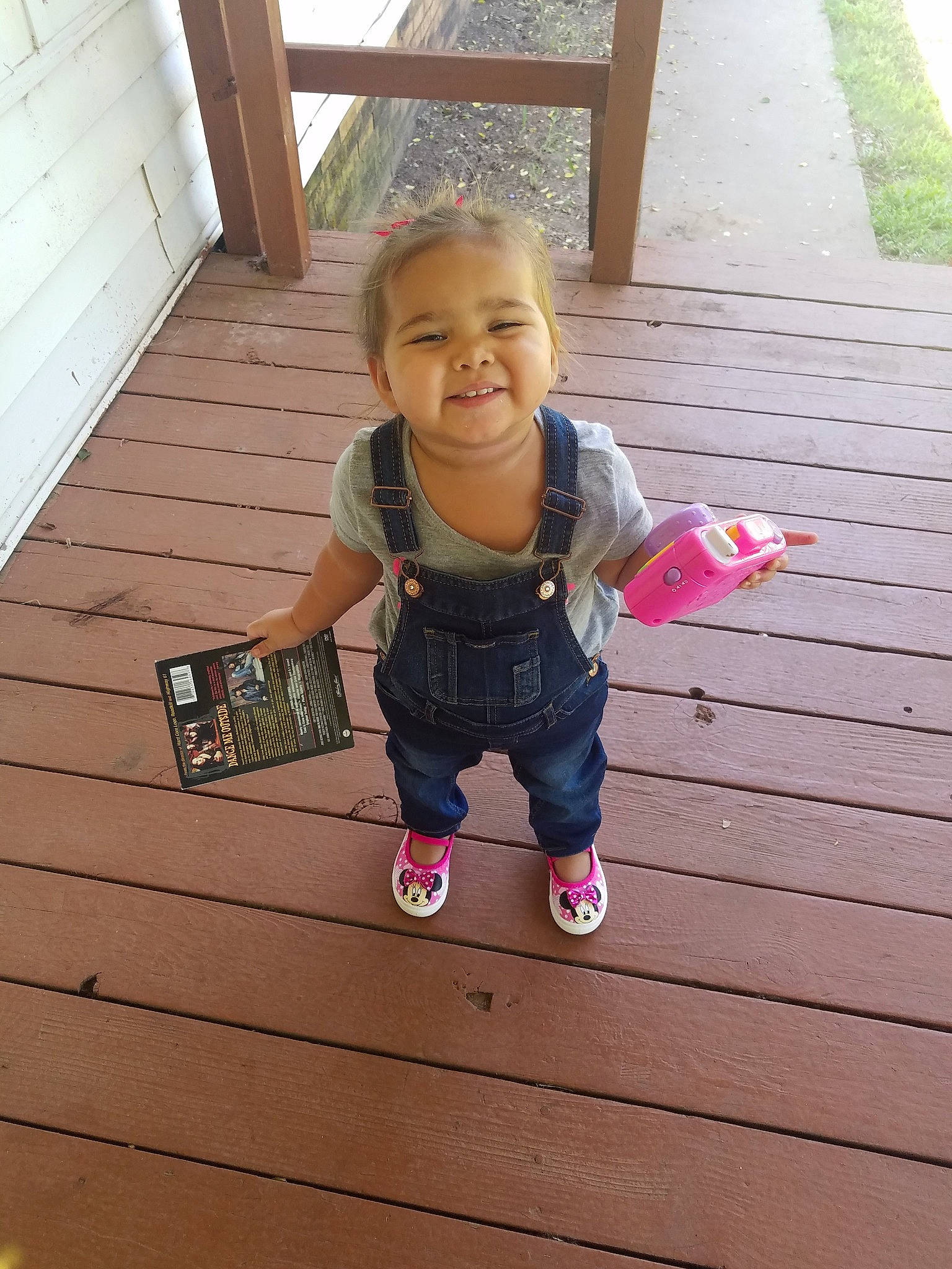 Raylynn is registered to the contest to win money with this photo: baby, child, facial_expression, floor, happy, home, joy, leg, person, pink, play, skin, smile, standing, summer, t_shirt, toddler, vacation, wood