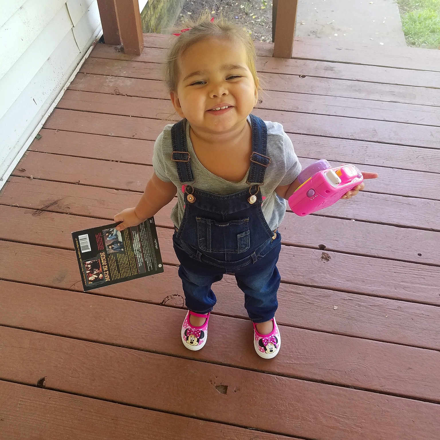 Raylynn is registered to the contest to win money with this photo: baby, child, facial_expression, floor, happy, home, joy, leg, person, pink, play, skin, smile, standing, summer, t_shirt, toddler, vacation, wood