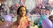Devani joined the competition — help win amazing prizes! child, birthday, cake, pink_dress, balloons, flowers, rainbow, party, toddler, celebration, smile, table, decorations, cute, cake_stand, first_birthday, indoor, happy, person, festive
