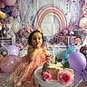 child, birthday, cake, pink_dress, balloons, flowers, rainbow, party, toddler, celebration, smile, table, decorations, cute, cake_stand, first_birthday, indoor, happy, person, festive