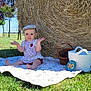 baby, child, hat, blanket, grass, hay_bale, basket, outdoor, sunny, smile, dress, blue_sky, nature, summer, field, sitting, person, greenery, playful, cute