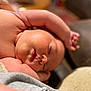 Exzavian is registered to the contest to win money with this photo: baby, bodypart, clothing, face, finger, glove, hand, head, newborn, person, photography, portrait, sleeping, towel