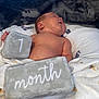 Exzavian is registered to the contest to win money with this photo: architecture, baby, bed, blanket, building, clothing, crib, cushion, face, furniture, glove, head, homedecor, hospital, infantbed, newborn, person, photography, portrait, sleeping