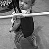 Brentlee joined the competition — help win amazing prizes! toddler, baby, jumper, indoors, carpet, striped_pants, child, playtime, looking_back, curious, infant, baby_toys, black_and_white, floor, legs, feet, clothing, young_child, baby_bouncer, play_area