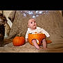 Matilda is registered to the contest to win money with this photo: baby, carving, child, costume, curious, cute, decorations, dog, fairy_lights, festive, fur, halloween, holiday, indoor, orange, pet, pumpkin, seasonal, sitting, white_clothing