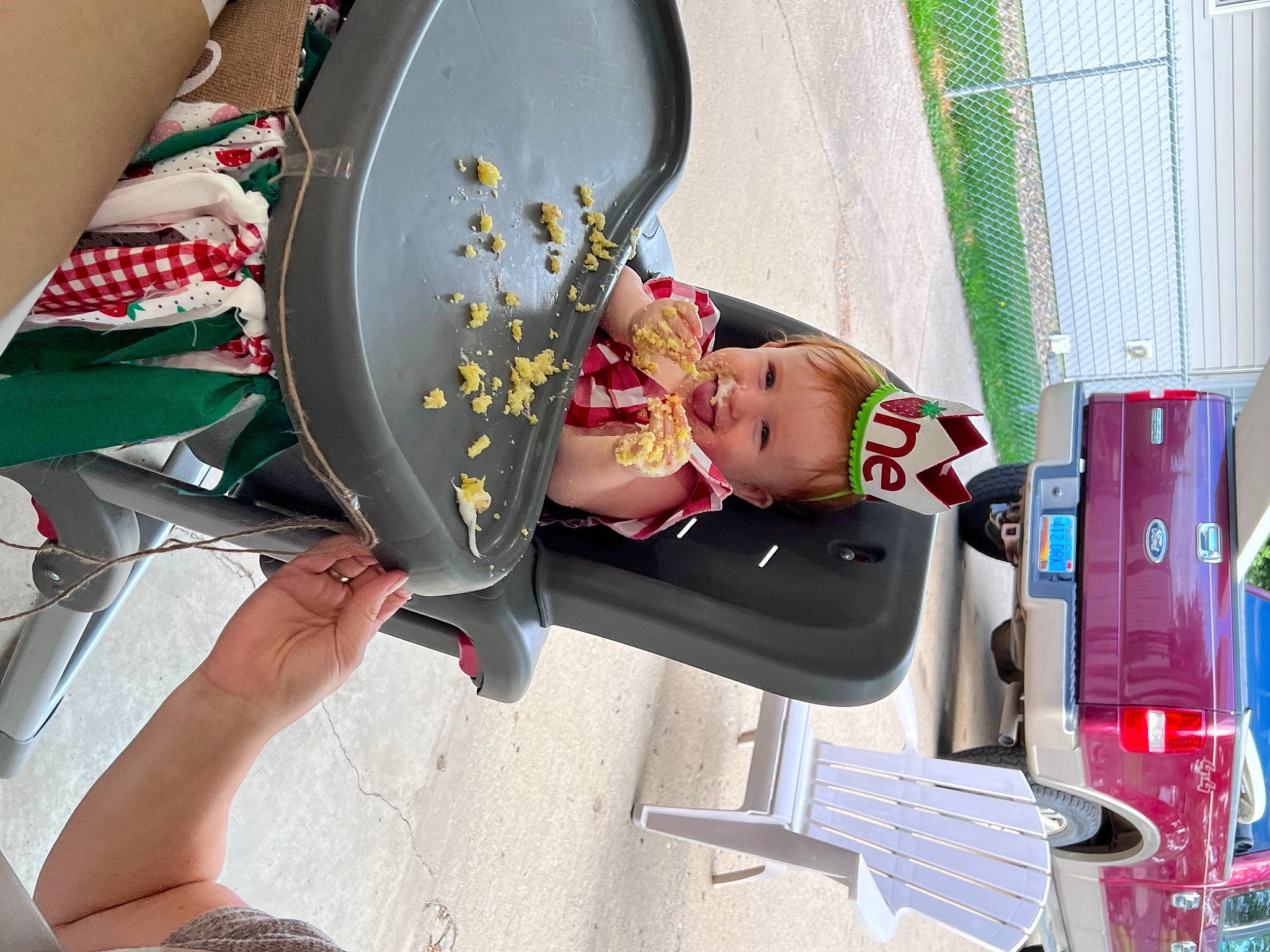 Annelise is registered to the contest to win money with this photo: baby, baby_products, car, chair, child, eyewear, food, fun, homemaker, human_leg, joy, knee, nail, person, room, sitting, thigh, tire, toddler, toy