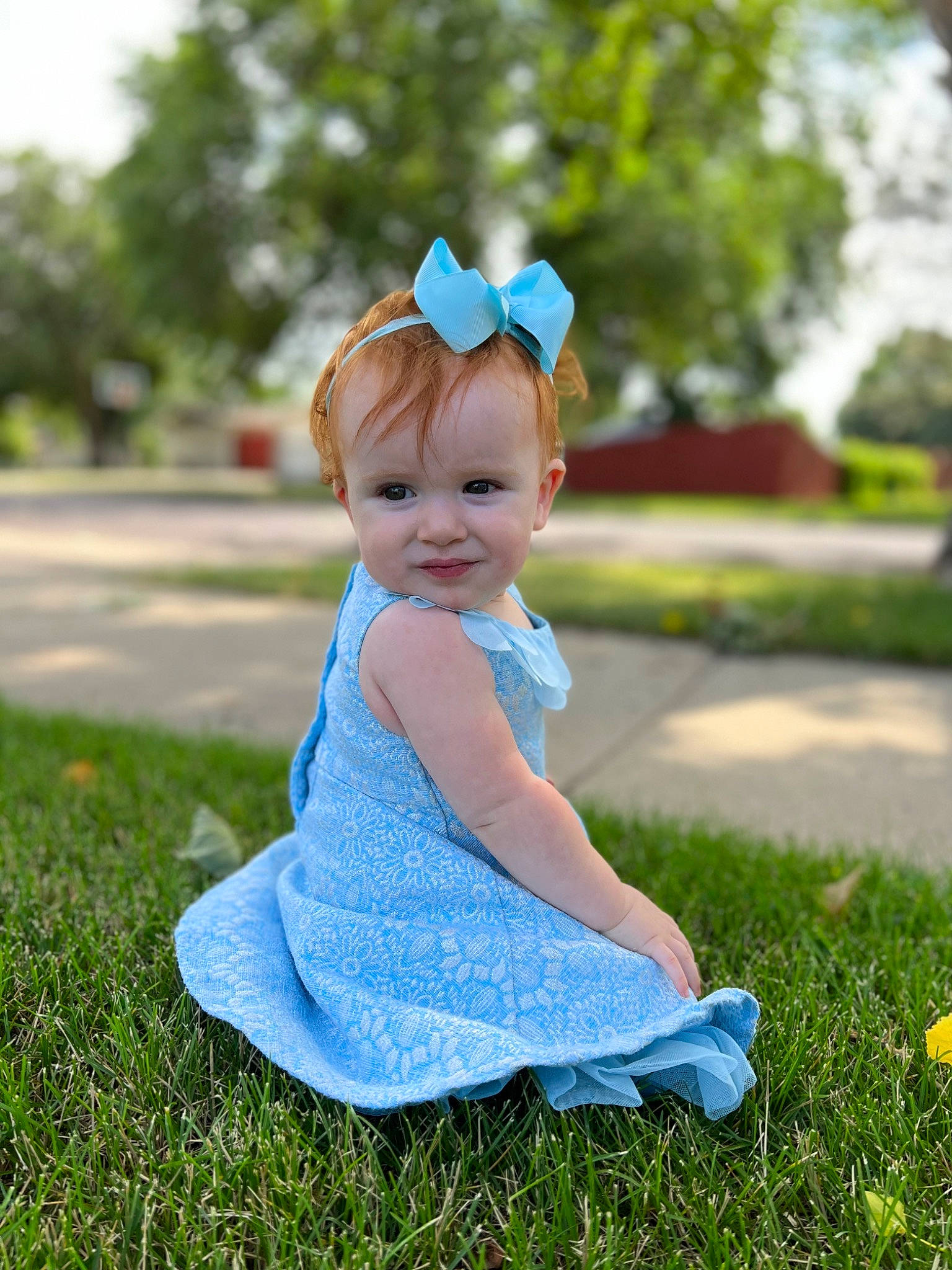 Annelise is registered to the contest to win money with this photo: azure, baby, baby_toddler_clothing, child, electric_blue, fun, grass, grassland, happy, headband, headpiece, joy, leisure, pattern, people_in_nature, person, plant, recreation, sitting, smile
