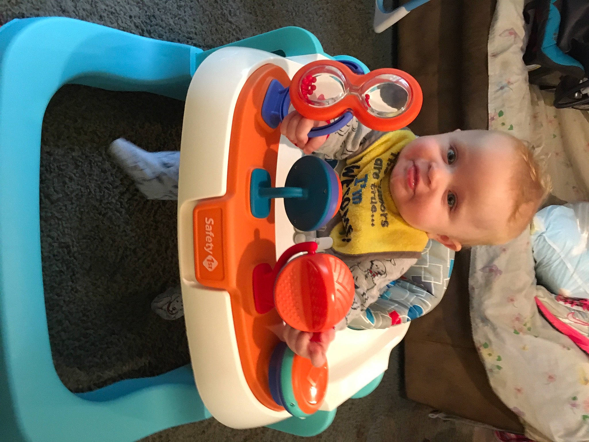 Blake is registered to the contest to win money with this photo: baby, baby_products, baby_toddler_clothing, baby_toys, chair, child, circle, comfort, fun, happy, leisure, person, plastic, play, recreation, room, sitting, smile, toddler, toy
