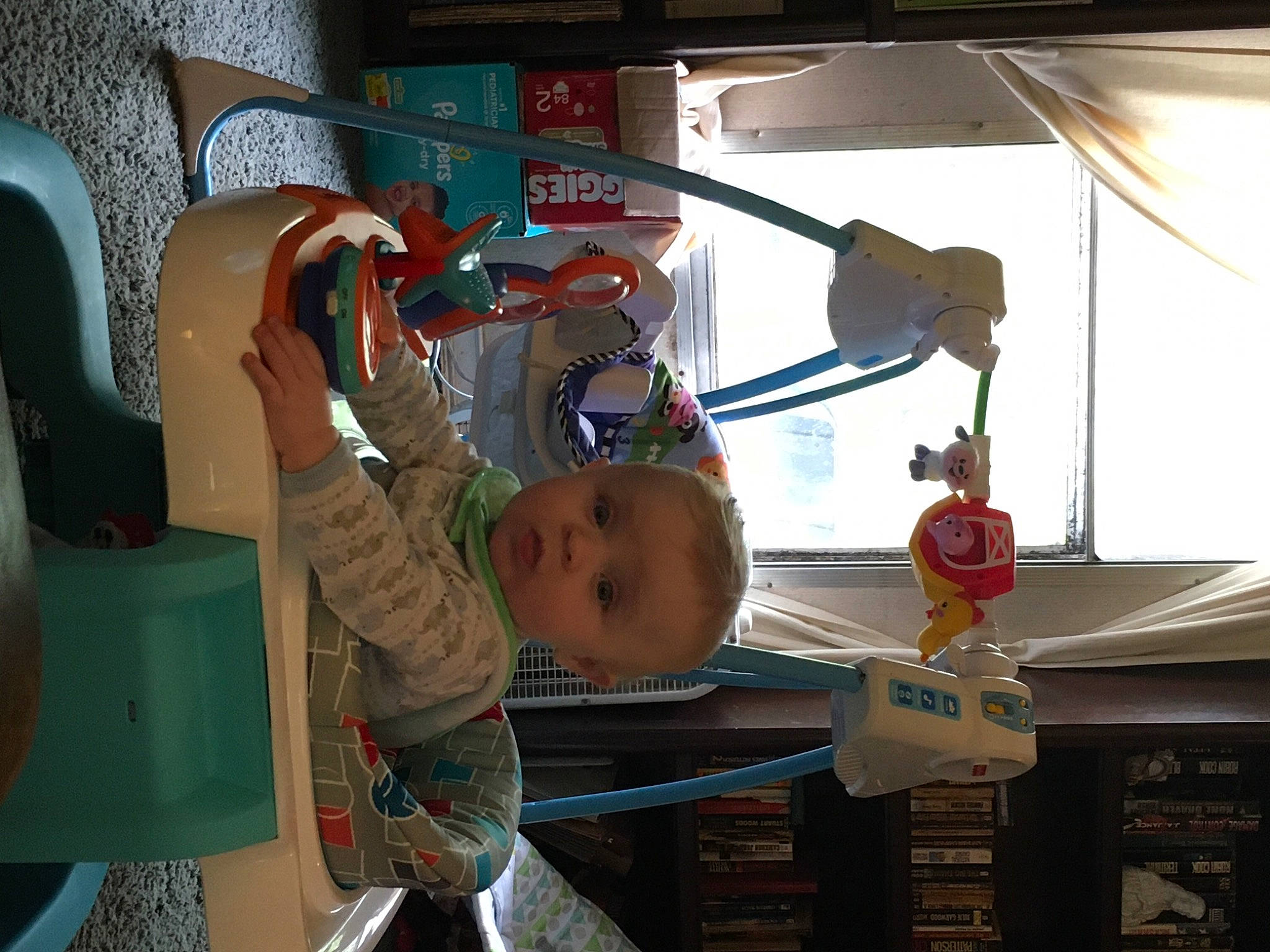 Blake is registered to the contest to win money with this photo: baby, baby_toddler_clothing, chair, child, fun, glass, hat, leisure, motor_vehicle, person, room, t_shirt, toddler, travel, vacation