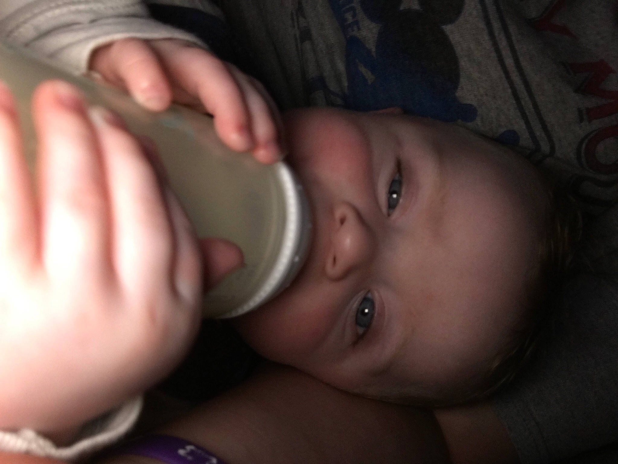 Blake is registered to the contest to win money with this photo: arm, baby, baby_bottle, cheek, drinkware, ear, eyelash, finger, gesture, hand, helmet, human_body, iris, lip, mouth, nose, person, plastic_bottle, skin, thumb