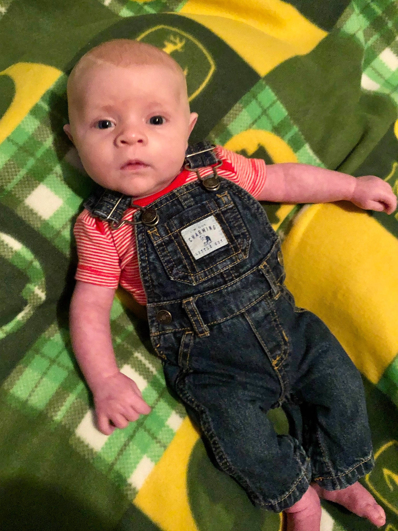 River is registered to the contest to win money with this photo: baby, child, jeans, pattern, person, plaid, textile, toddler