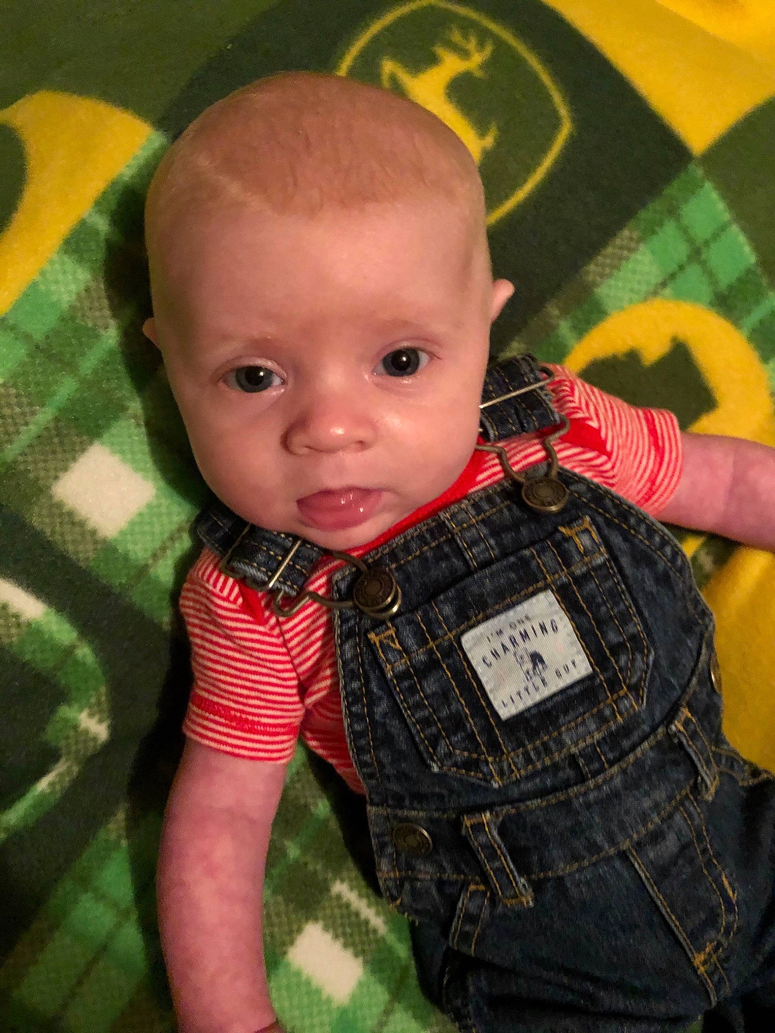 River is registered to the contest to win money with this photo: baby, cheek, child, design, pattern, person, plaid, toddler