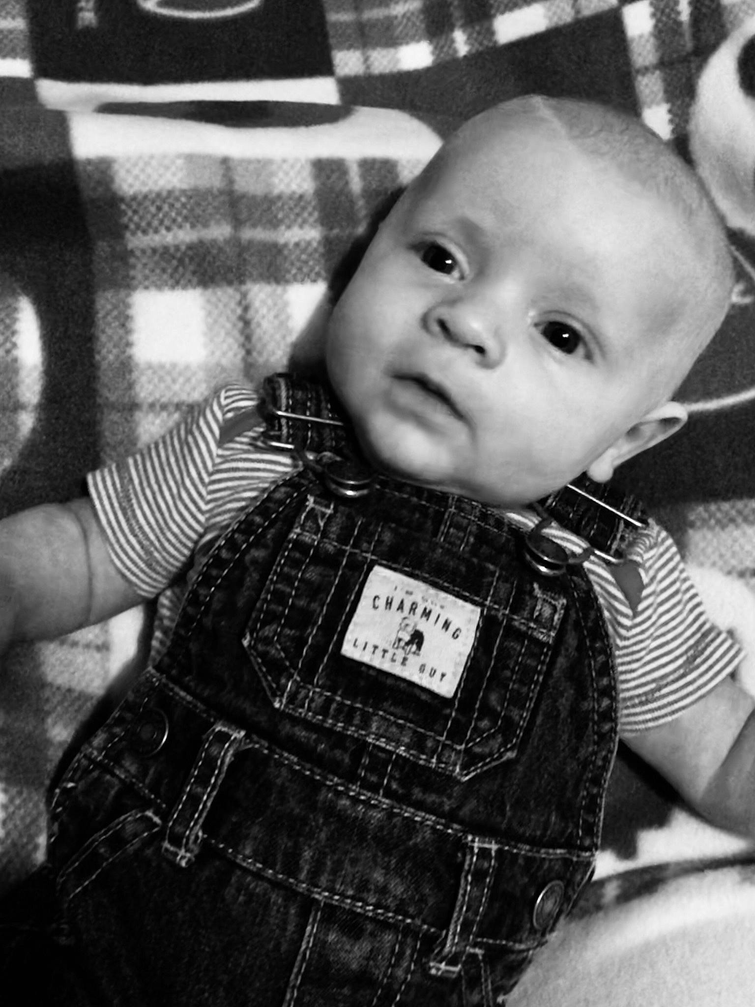 River is registered to the contest to win money with this photo: baby, black, black_and_white, cheek, child, eye, face, family, head, monochrome, people, person, photography, product, sitting, skin, smile, style, toddler