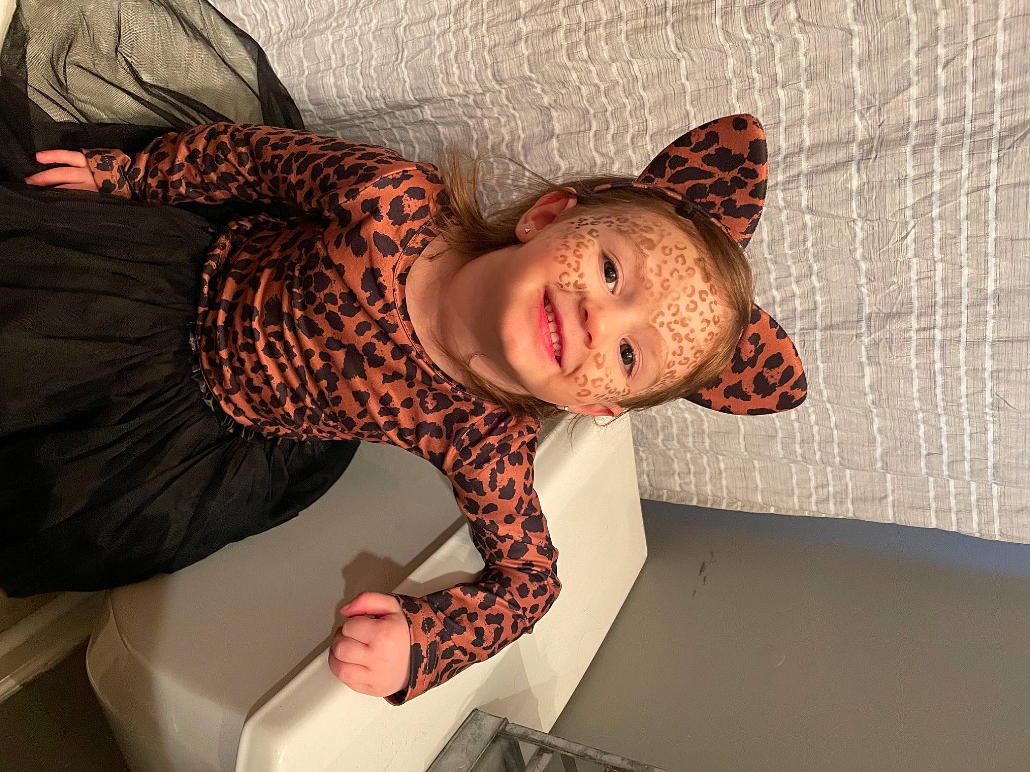 Arabella is registered to the contest to win money with this photo: arm, art, baby, child, comfort, costume_hat, fashion_accessory, fun, fur, hat, joy, pattern, person, room, smile, suit, sun_hat, thigh, toddler