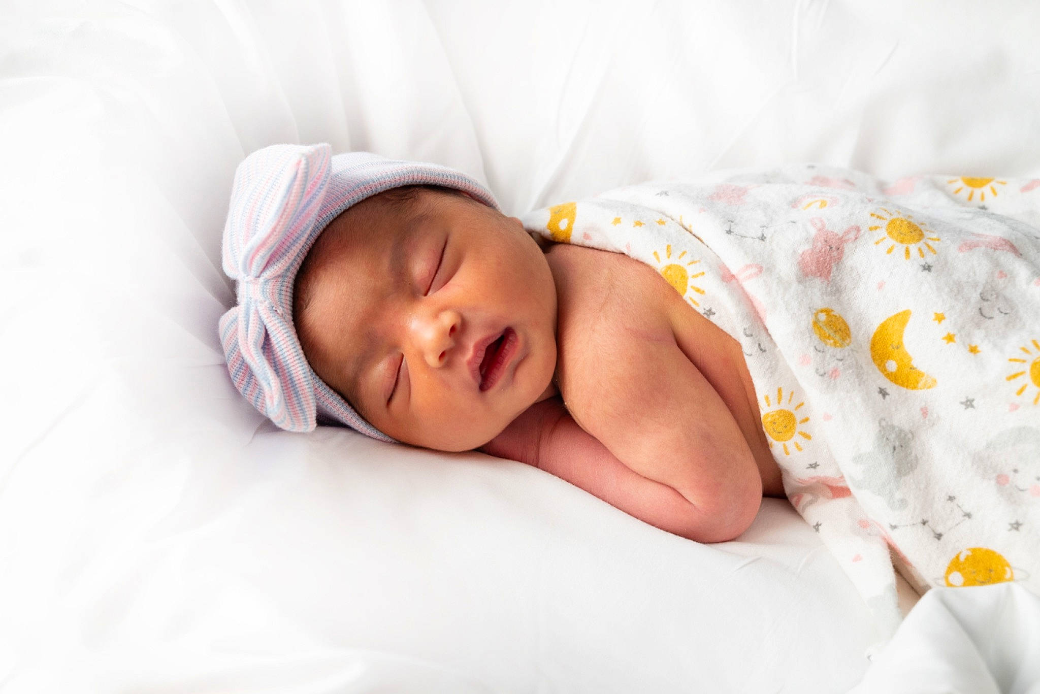 Crystal is registered to the contest to win money with this photo: baby, baby_products, baby_sleeping, baby_toddler_clothing, bedding, bedtime, cap, child, comfort, fashion_accessory, hat, headwear, linens, nap, pattern, person, portrait_photography, room, sitting, sleep